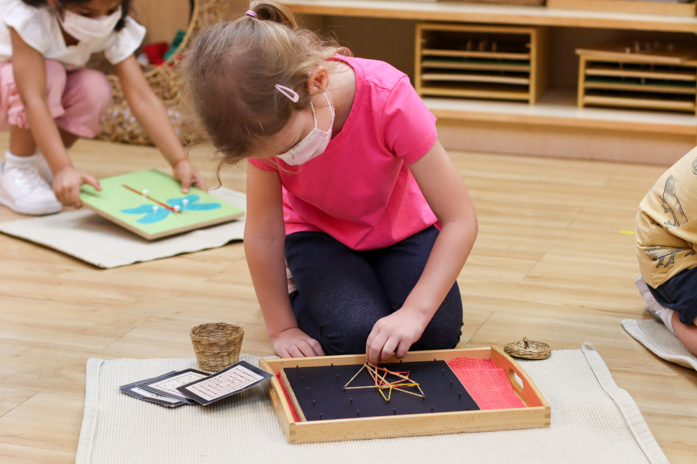 young girl playing at a Montessori kindergarten